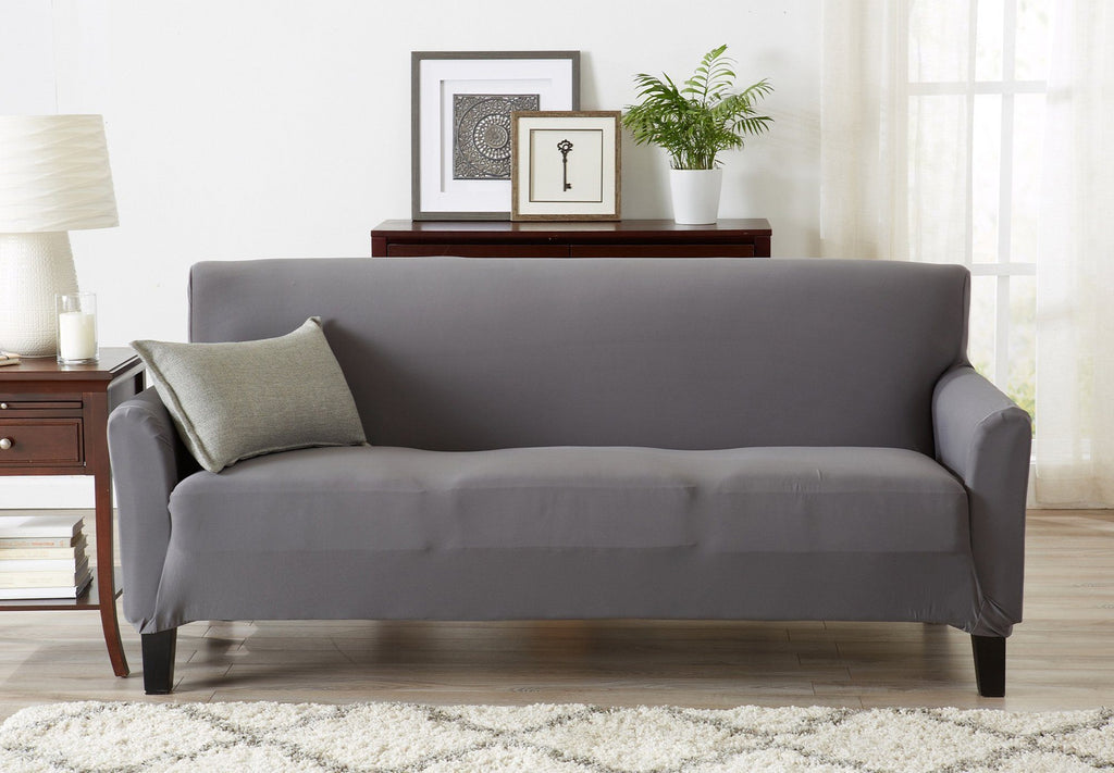 Living room couch with great bay home slipcover.