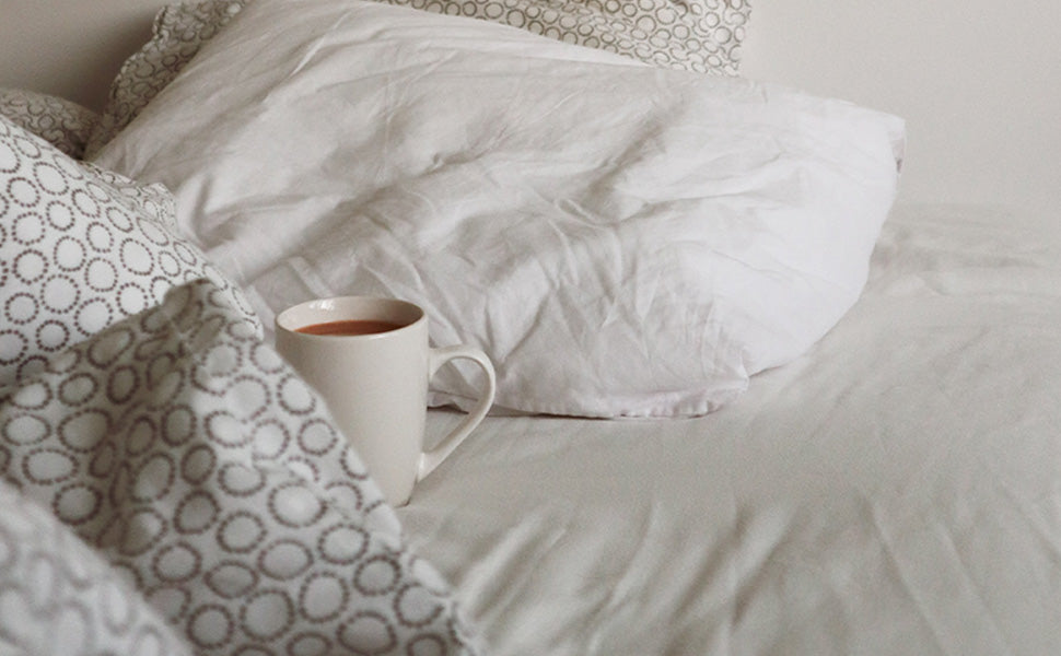 bed with coffee cup