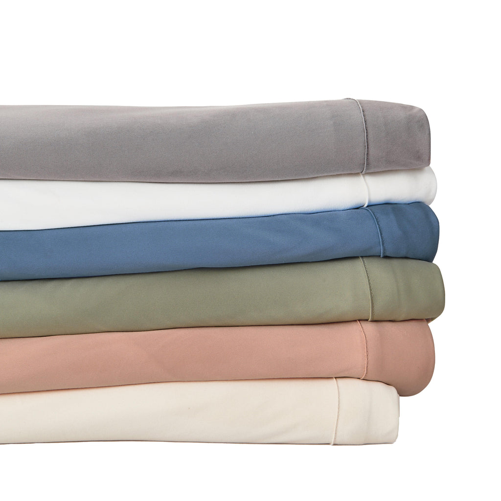 Great Bay Home Sheets 4-Piece Interlock Microfiber Sheet Set - Mackenna Collection Fall asleep in sheets that will wrap you up in luxurious softness. This sheet set is uniquely woven to offer a flexible feel while still keeping that lightweight microfiber feel. These breathable sheets will keep you comfortable and cozy all year long. These solid colors will match your bedroom decor effortlessly!